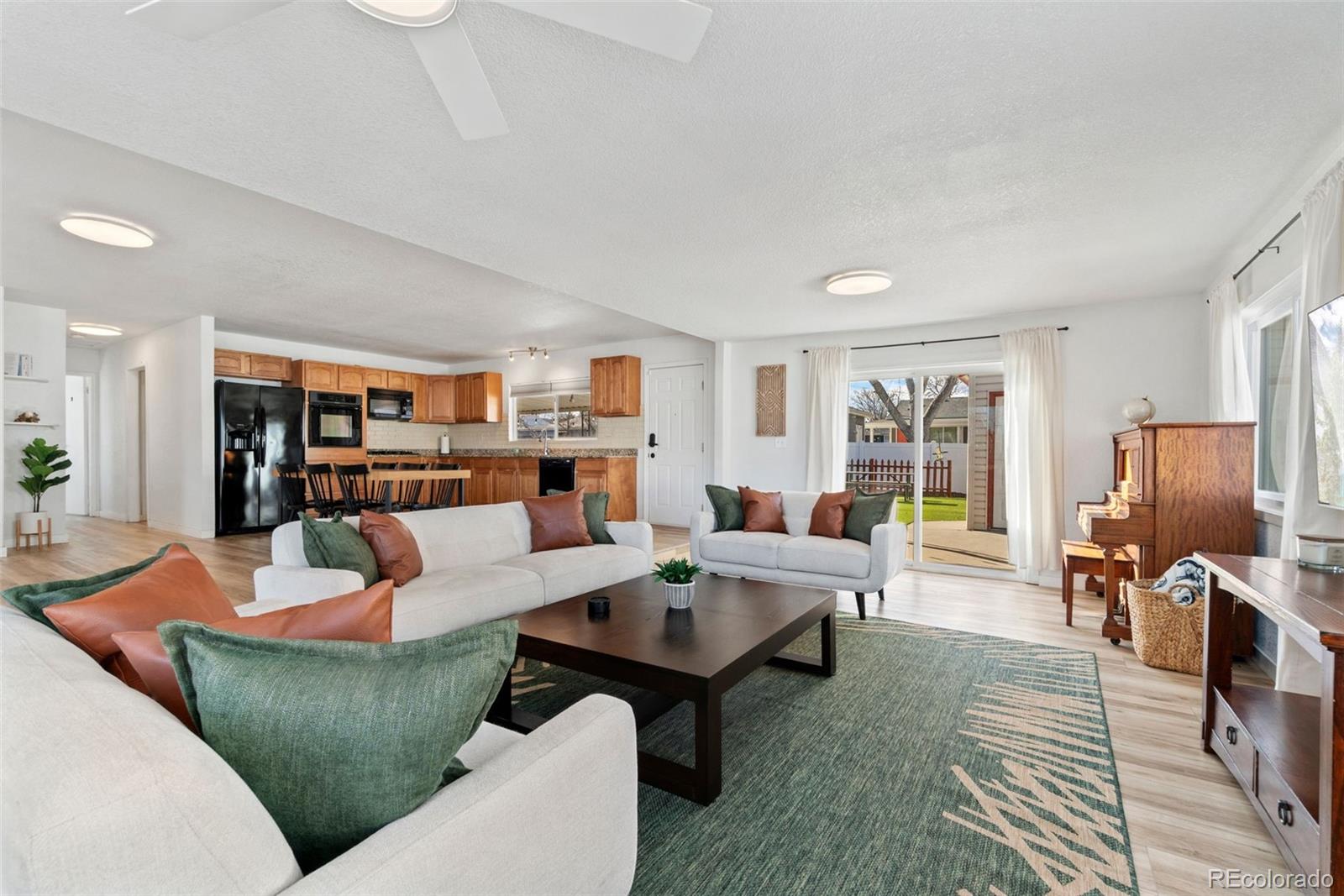 5533 Raritan Way Denver, CO 80221 - Photo 1 of 22 a living room with furniture and a flat screen tv