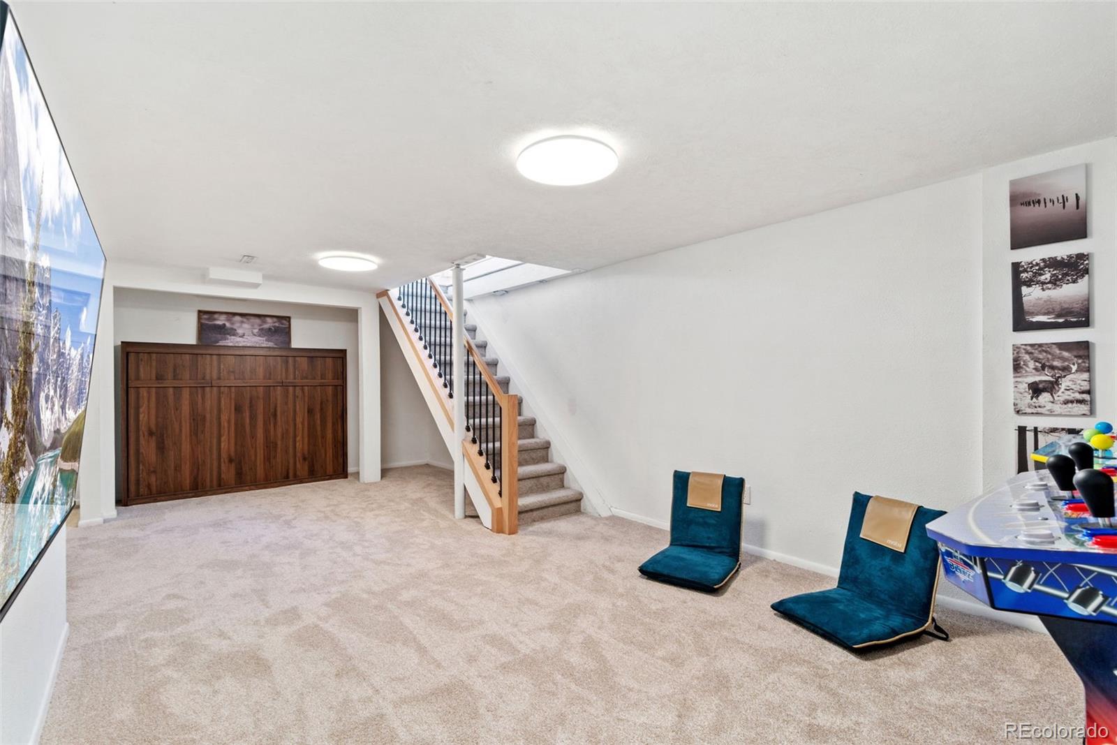 5533 Raritan Way Denver, CO 80221 - Photo 12 of 22 a view of livingroom with furniture and stairs