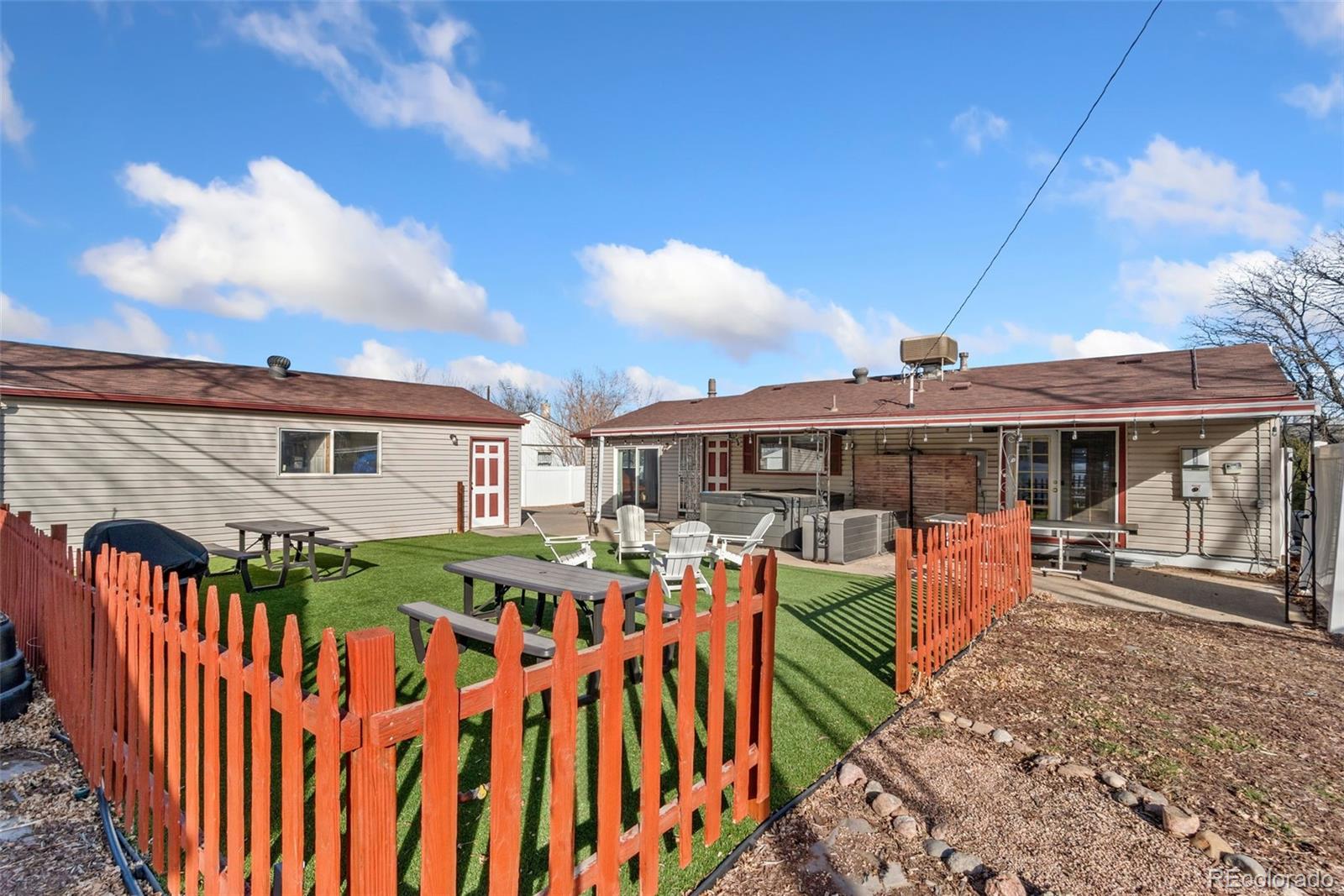 5533 Raritan Way Denver, CO 80221 - Photo 18 of 22 a view of a house with backyard and sitting area