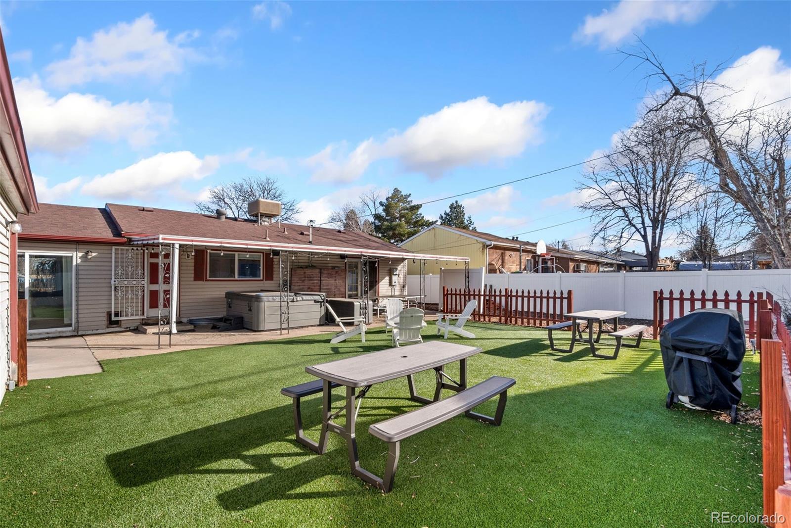 5533 Raritan Way Denver, CO 80221 - Photo 19 of 22 a view of a house with backyard porch and sitting area