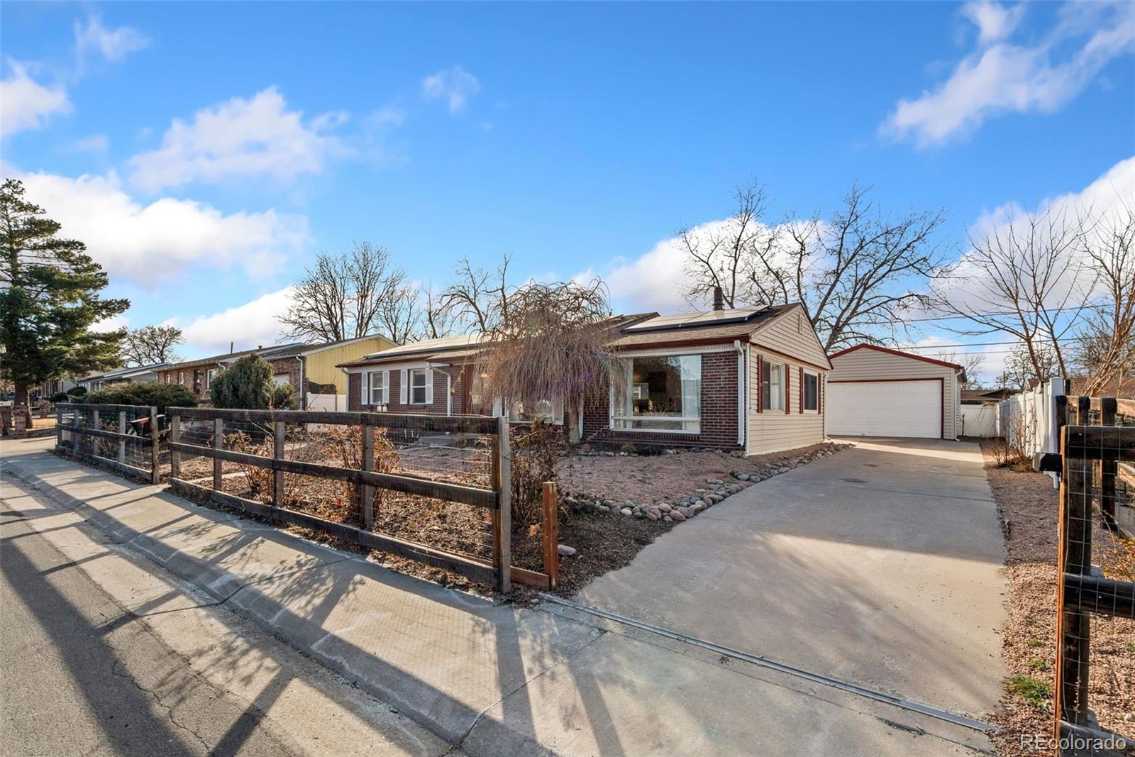 5533 Raritan Way Denver, CO 80221 - Photo 22 of 22 a view of a house with a yard