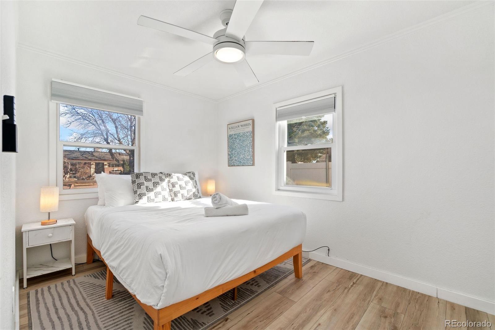 5533 Raritan Way Denver, CO 80221 - Photo 9 of 22 a bedroom with a bed and a window