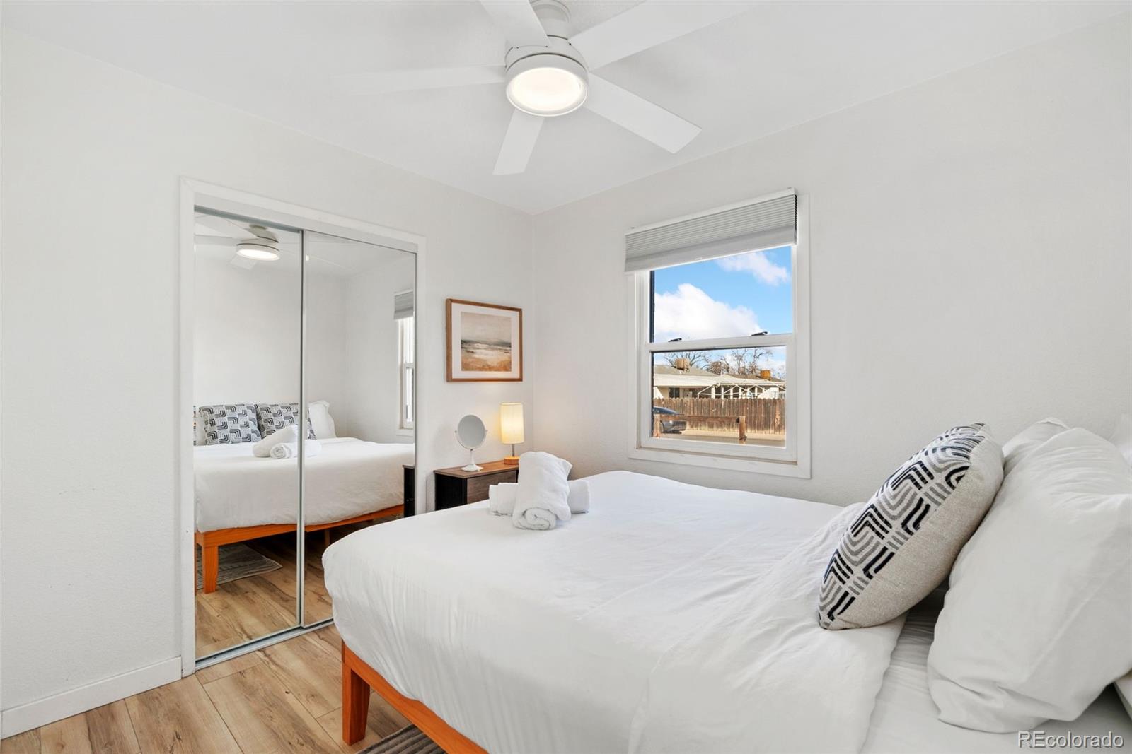 5533 Raritan Way Denver, CO 80221 - Photo 10 of 22 a bedroom with two beds and a window