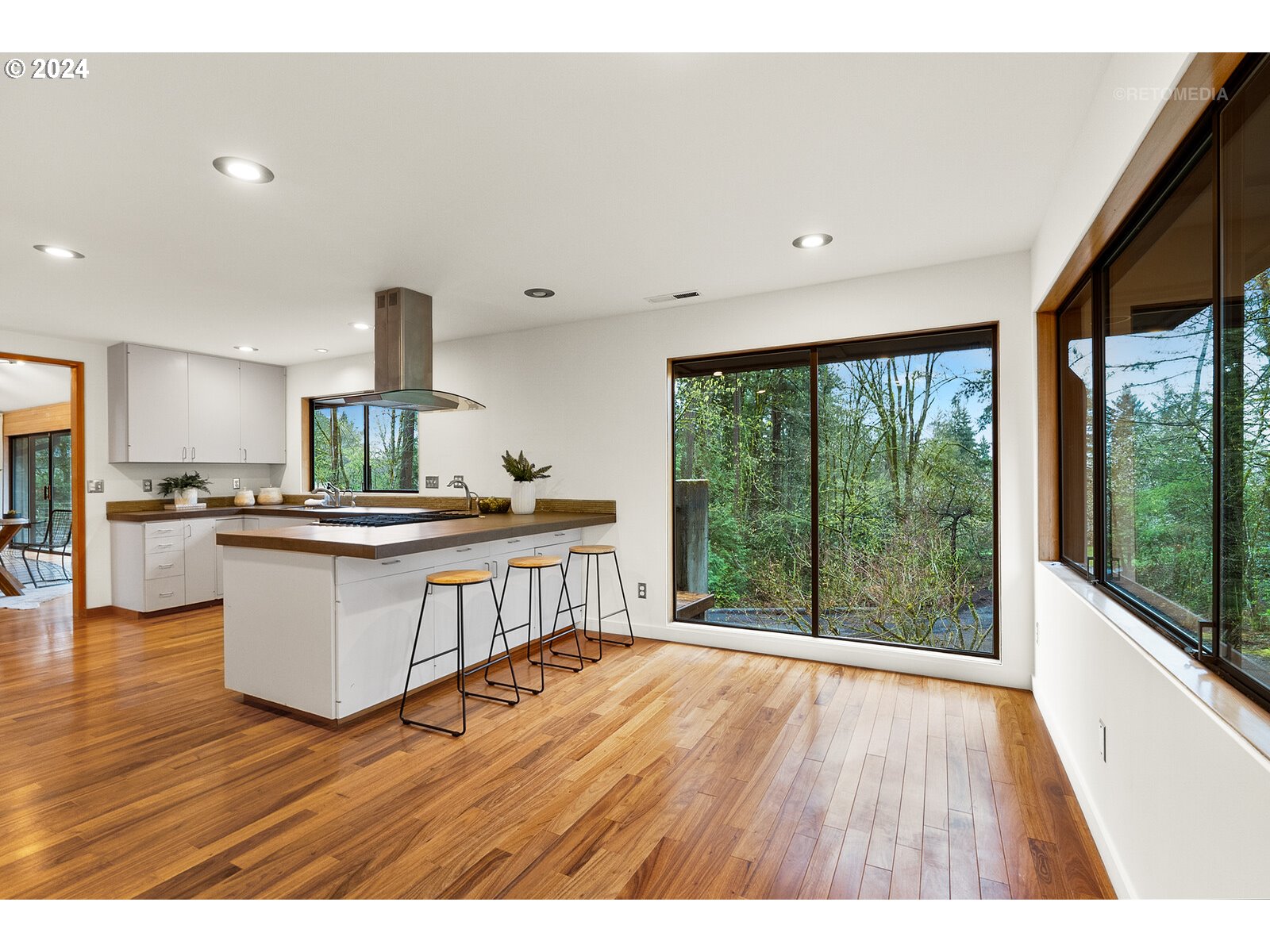 3730 Southwest Shattuck Road Portland, OR 97221 - Photo 13 of 44 a open kitchen with stainless steel appliances granite countertop a stove a sink and a wooden floors