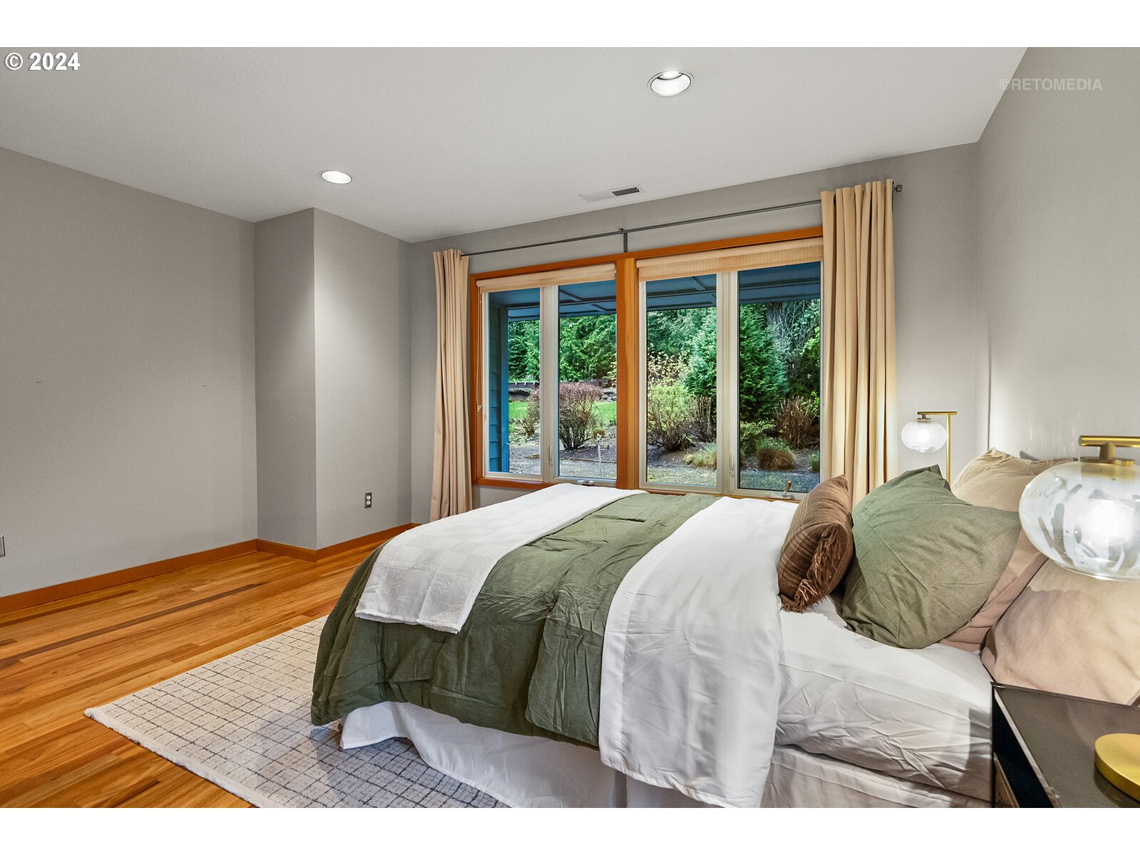 3730 Southwest Shattuck Road Portland, OR 97221 - Photo 19 of 44 a bedroom with a bed and a large window