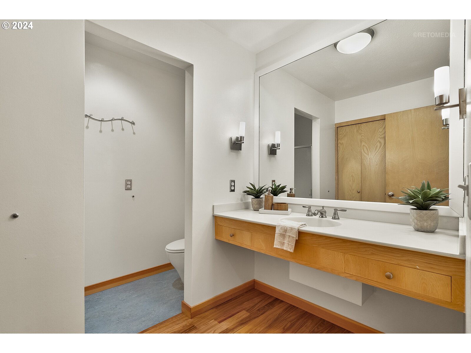 3730 Southwest Shattuck Road Portland, OR 97221 - Photo 20 of 44 a view of bathroom with a sink mirror and toilet
