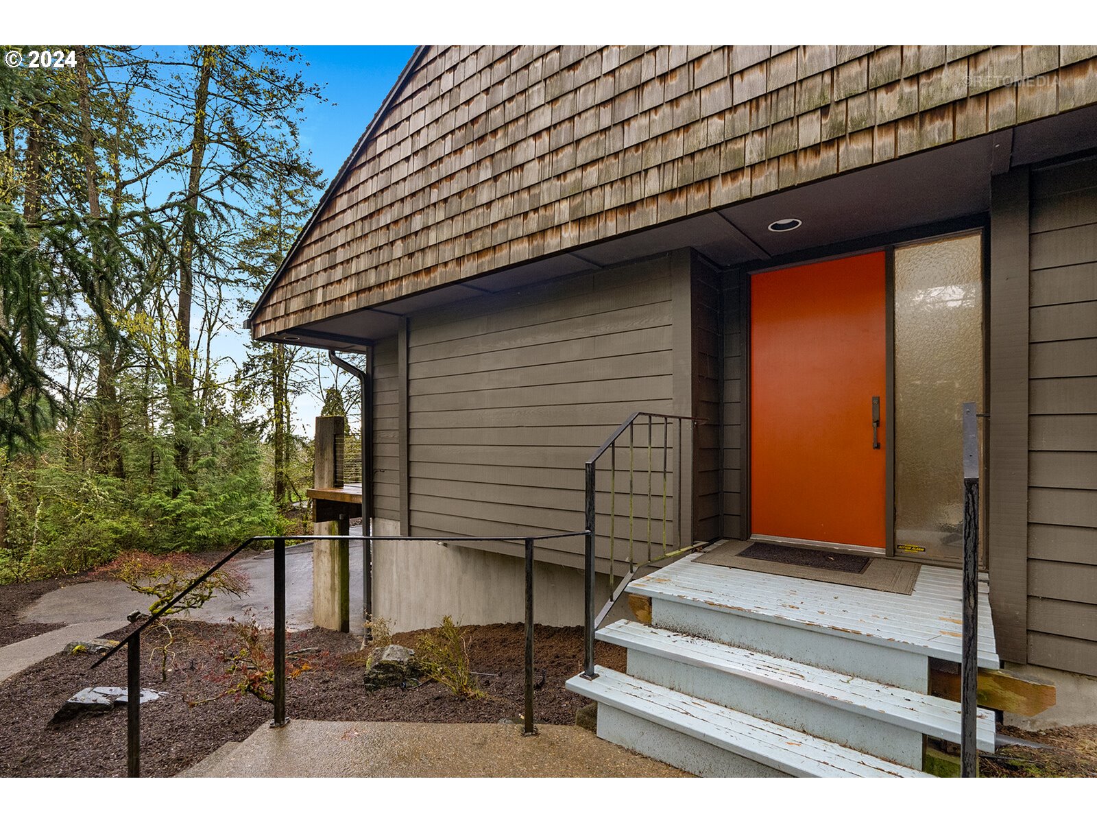 3730 Southwest Shattuck Road Portland, OR 97221 - Photo 3 of 44 a front view of a house with a garden