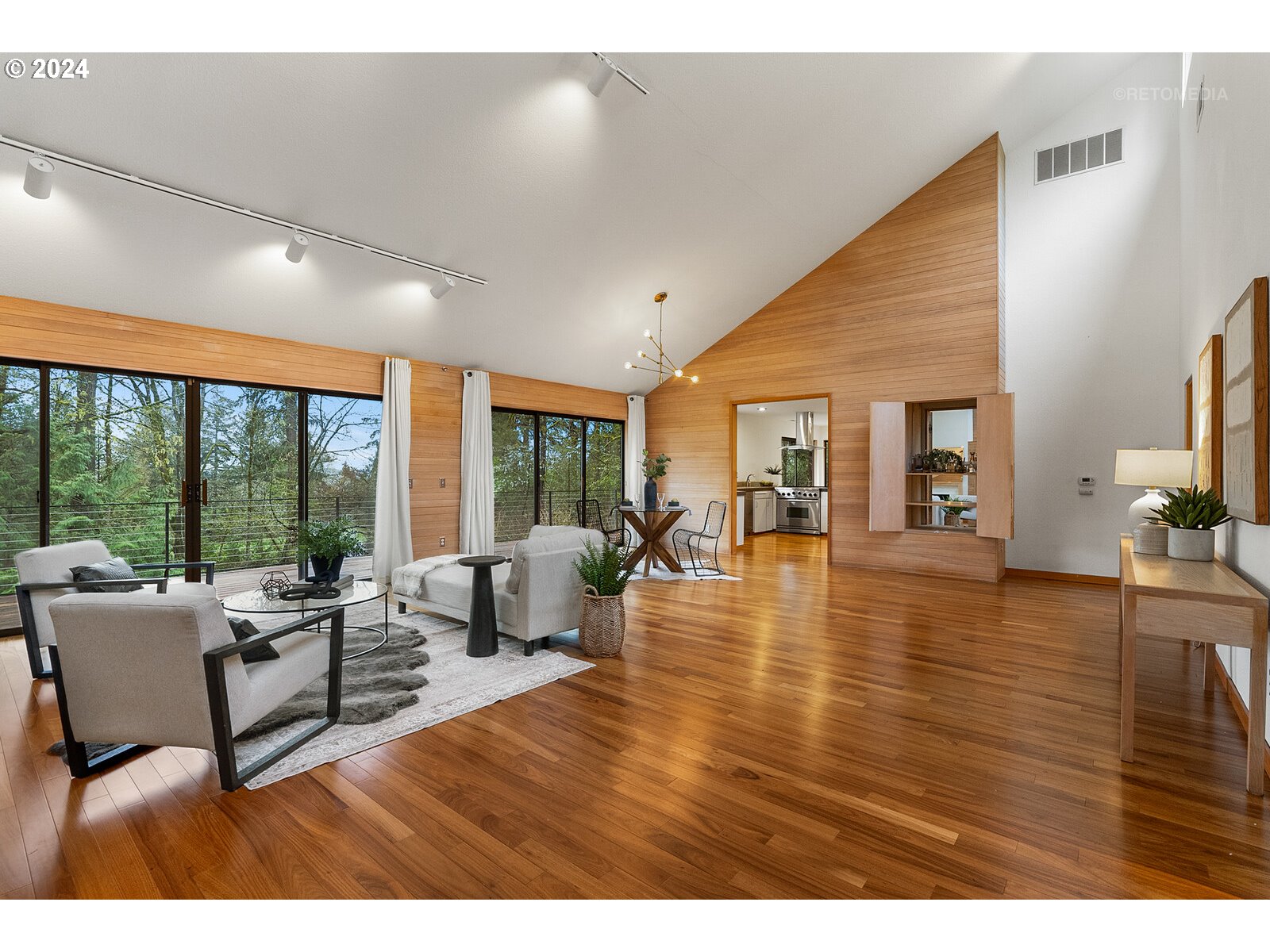 3730 Southwest Shattuck Road Portland, OR 97221 - Photo 4 of 44 a living room with furniture and a wooden floor