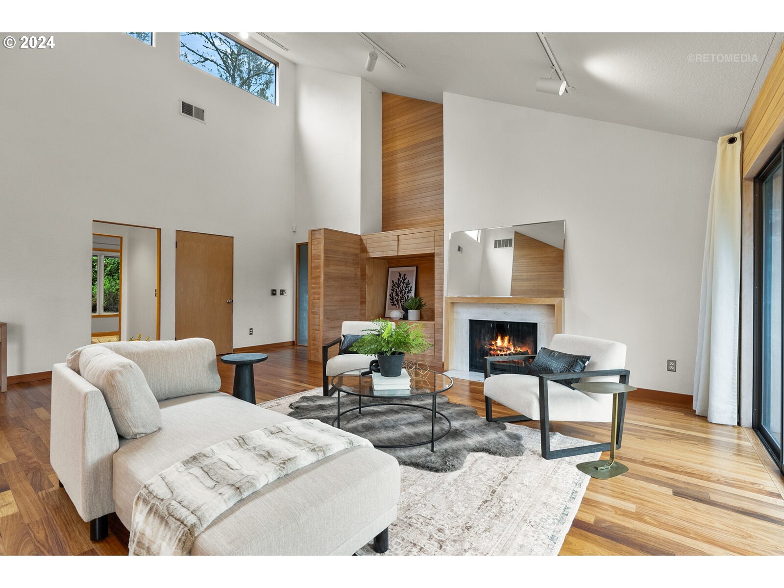 3730 Southwest Shattuck Road Portland, OR 97221 - Photo 7 of 44 a living room with furniture a fireplace and a table
