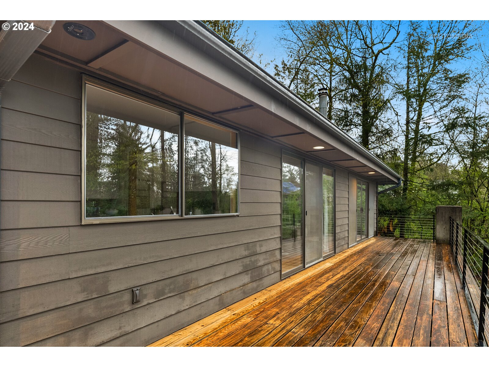 3730 Southwest Shattuck Road Portland, OR 97221 - Photo 9 of 44 a view of backyard with deck and wooden floor