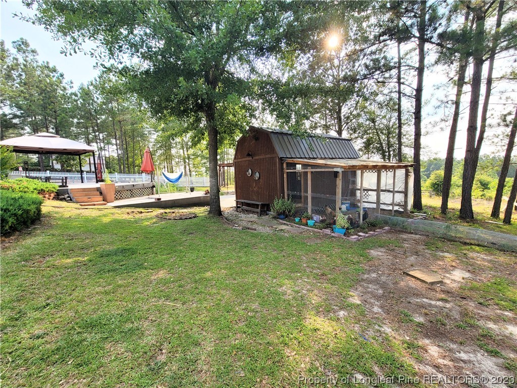 400 Ridge View Drive Cameron, NC 28326 - Photo 31 of 40 a view of a house with backyard and a tree