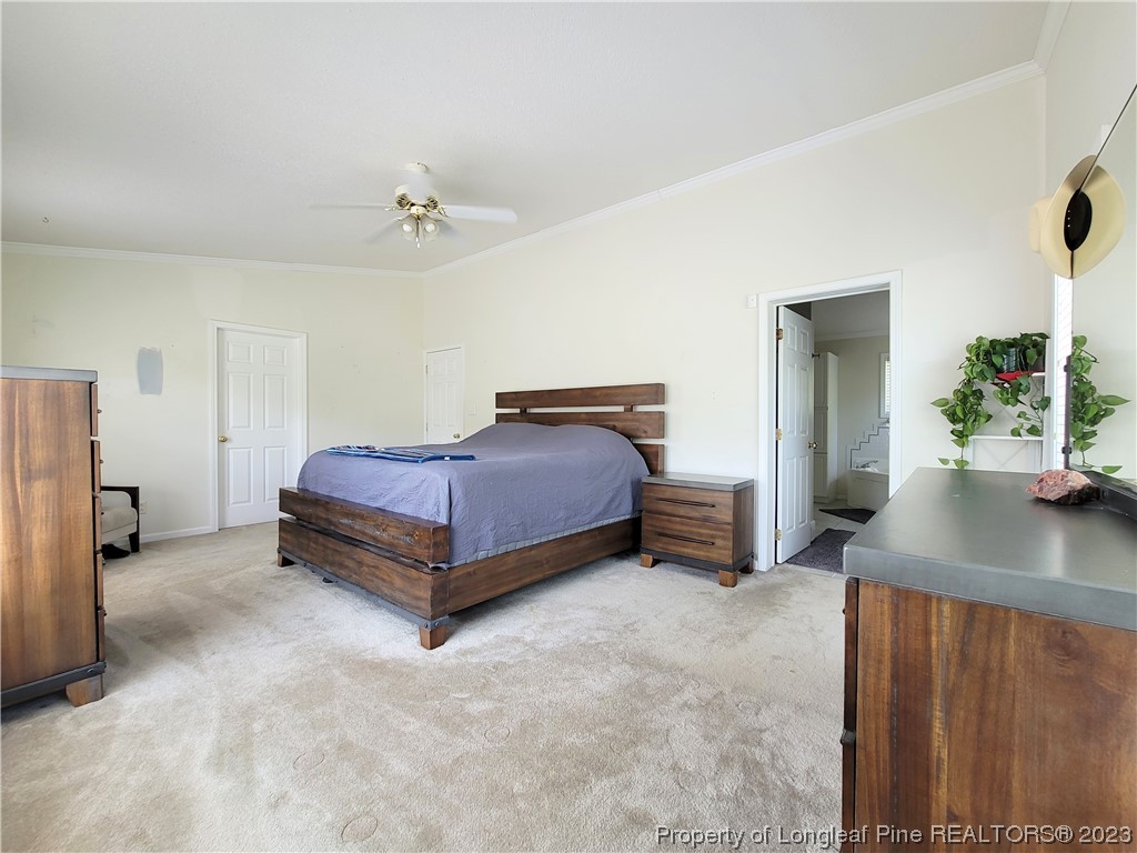 400 Ridge View Drive Cameron, NC 28326 - Photo 9 of 40 a bedroom with a bed and a table in it