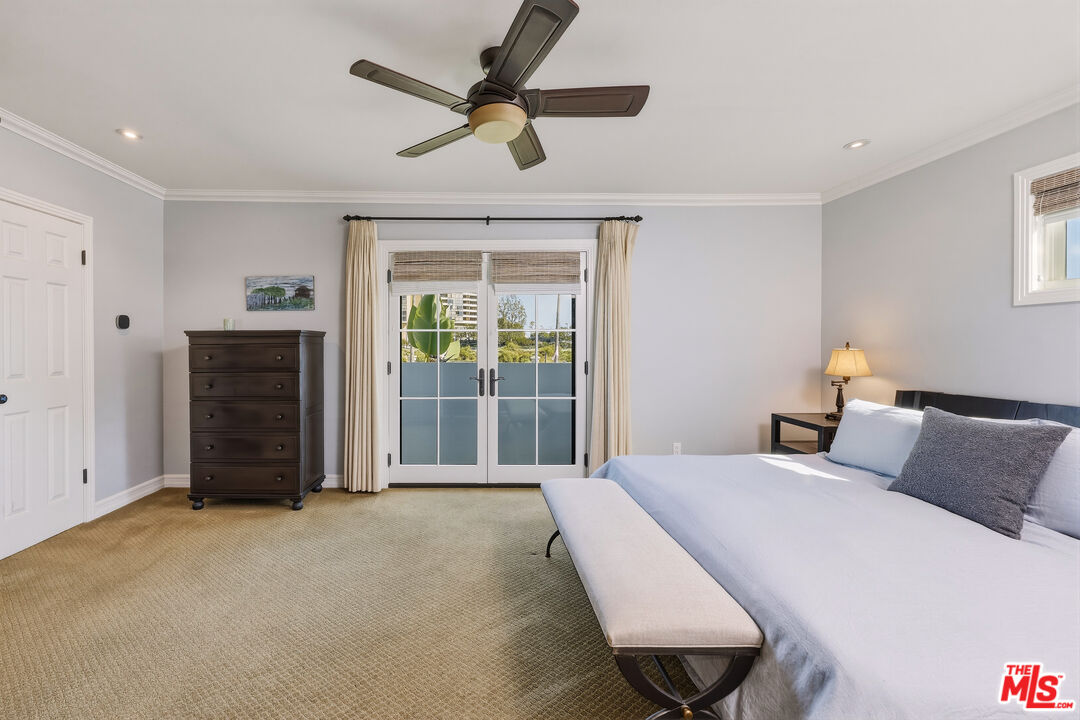 697 Washington Boulevard Marina del Rey, CA 90292 - Photo 20 of 23 a bedroom with a bed and a ceiling fan