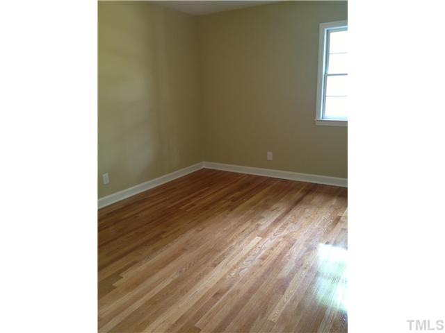 905 Powell Drive Raleigh, NC 27606 - Photo 11 of 11 Bedroom 2 is quite large, and features two windows for lots of light.