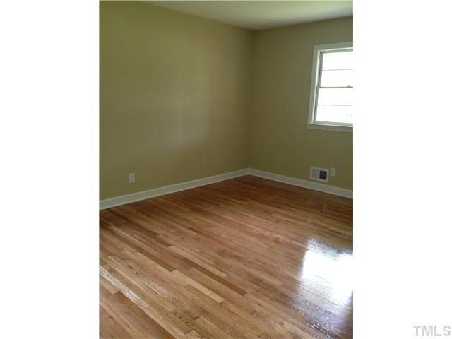 905 Powell Drive Raleigh, NC 27606 - Photo 9 of 11 Bright cheerful master bedroom with private half bath.