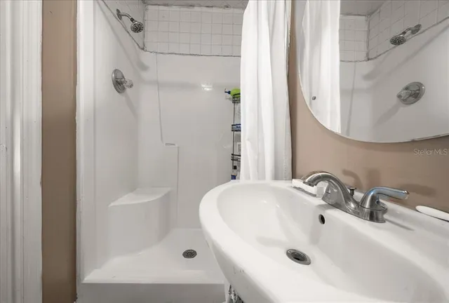 a bathroom with a sink and a mirror