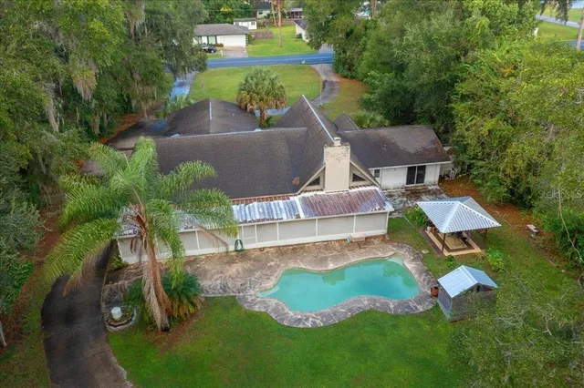 an aerial view of a house with a garden
