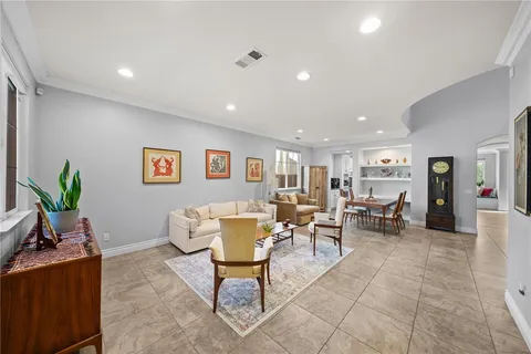 a kitchen with refrigerator and cabinets