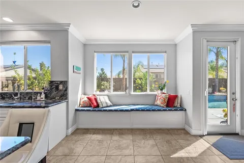 a view of entryway and hall with a front door