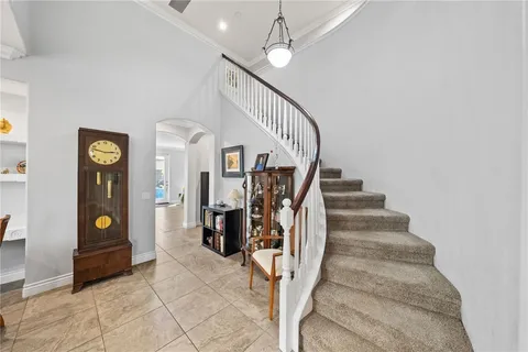 a view of a livingroom with workspace and a window