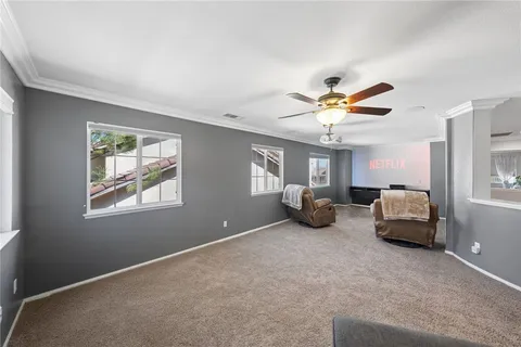 a spacious bedroom with a bed and a couch