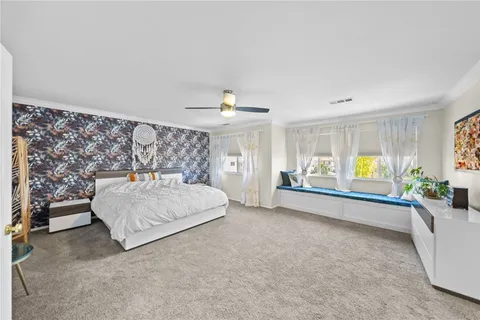 a view of a house with backyard porch and sitting area