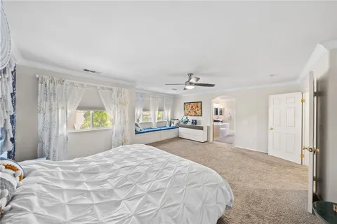 a view of a house with swimming pool and sitting area