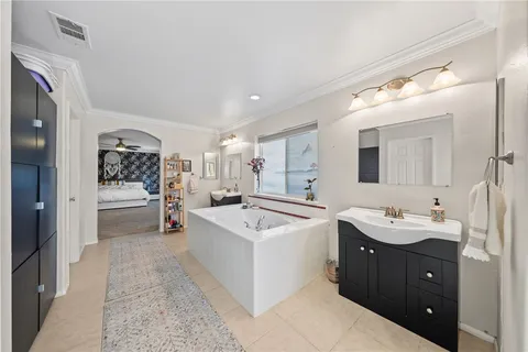 a view of a house with swimming pool lawn chairs and a yard