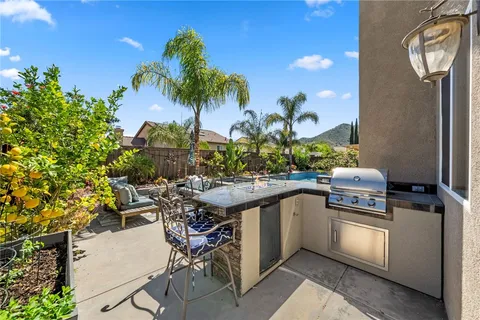 a view of a swimming pool with a table and chairs