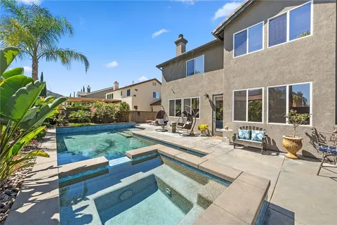 an aerial view of a residential apartment building with a yard