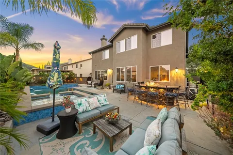 a view of a livingroom with furniture and a window