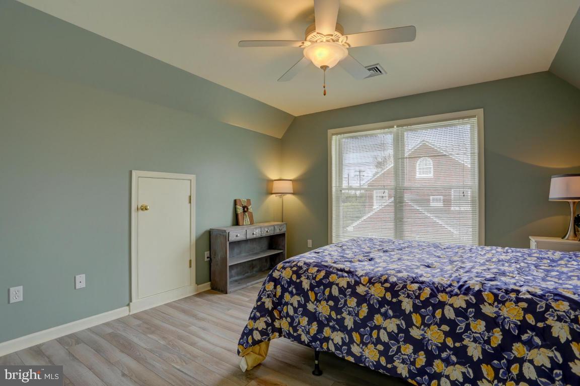249 East Oregon Road Lititz, PA 17543 - Photo 13 of 30 a bedroom with a bed and wooden floor