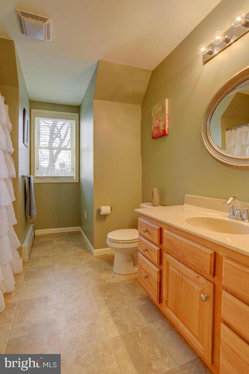 249 East Oregon Road Lititz, PA 17543 - Photo 14 of 30 a spacious bathroom with a granite countertop toilet a sink and a mirror