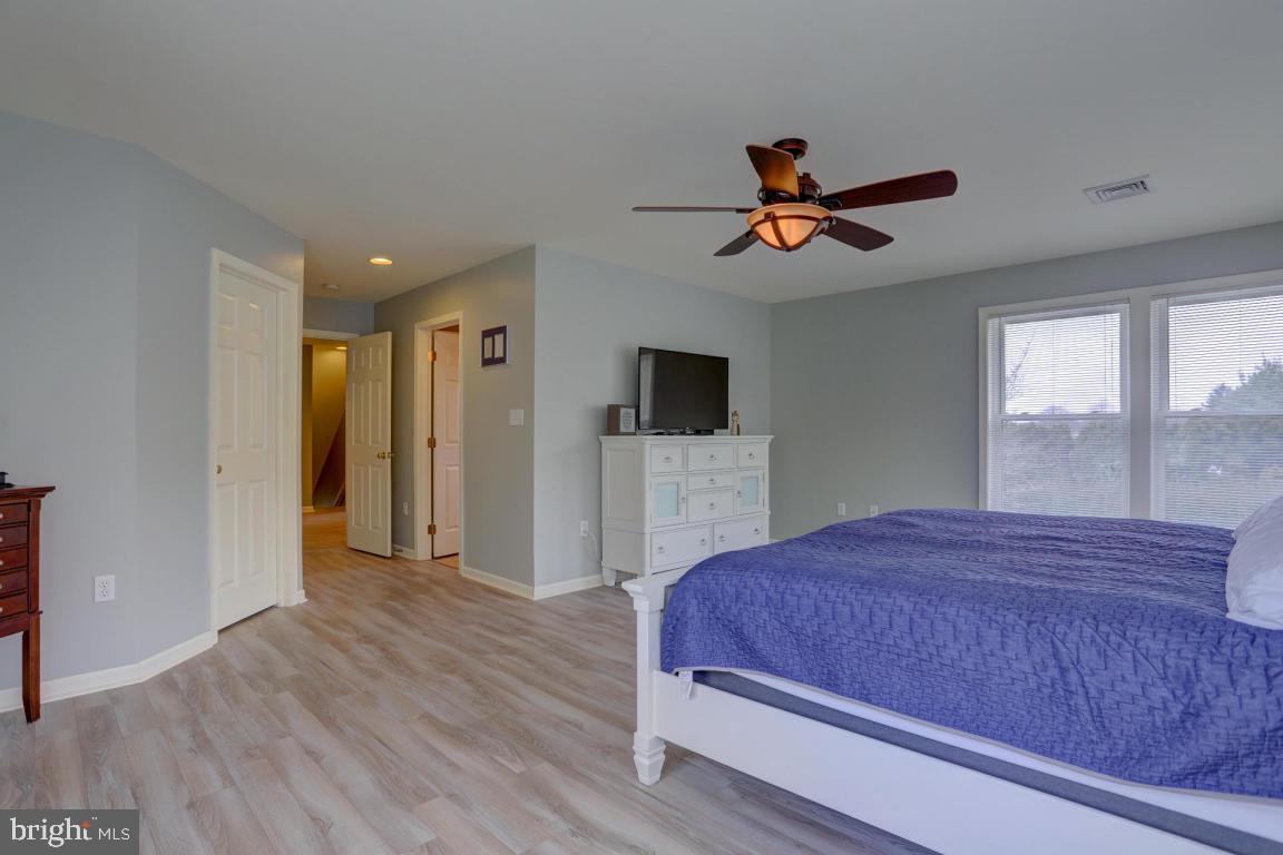 249 East Oregon Road Lititz, PA 17543 - Photo 18 of 30 a bedroom with a bed and a flat screen tv