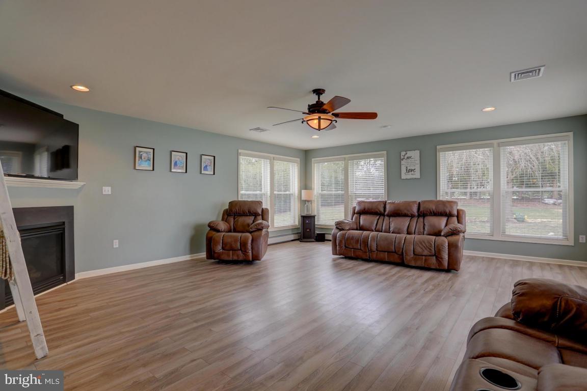 249 East Oregon Road Lititz, PA 17543 - Photo 20 of 30 a living room with furniture fireplace and a flat screen tv