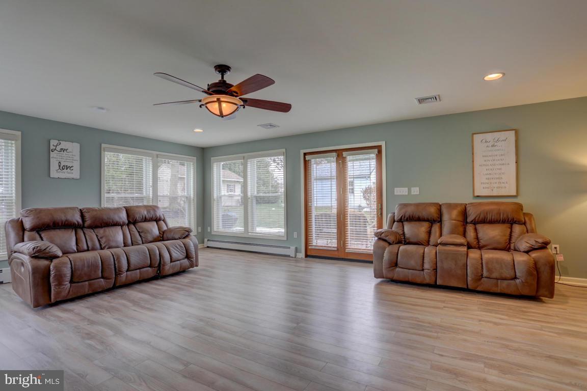 249 East Oregon Road Lititz, PA 17543 - Photo 21 of 30 a living room with furniture ceiling fan and a wooden floor