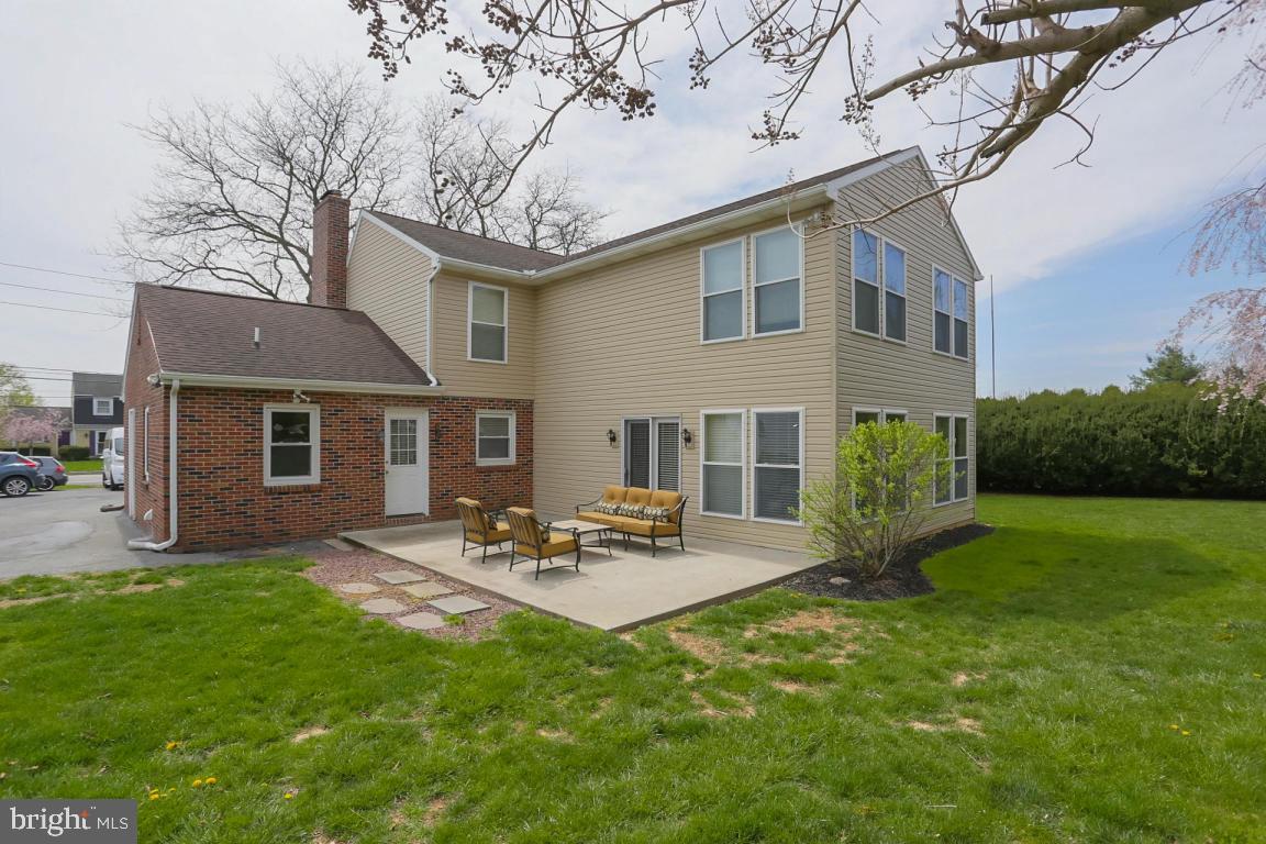 249 East Oregon Road Lititz, PA 17543 - Photo 27 of 30 a backyard of a house with garden and outdoor seating