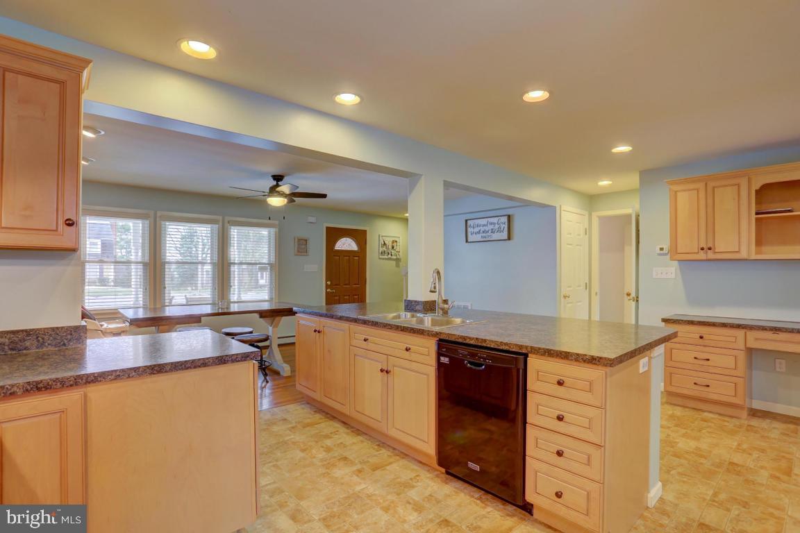 249 East Oregon Road Lititz, PA 17543 - Photo 4 of 30 a large kitchen with kitchen island a sink a center island and windows