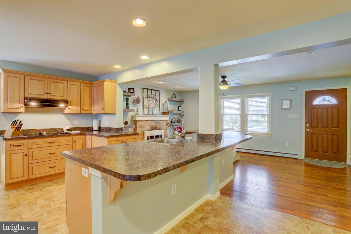 249 East Oregon Road Lititz, PA 17543 - Photo 6 of 30 a large kitchen with kitchen island a large counter top space a sink stainless steel appliances and cabinets