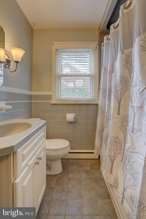 249 East Oregon Road Lititz, PA 17543 - Photo 10 of 30 a bathroom with a granite countertop toilet a sink and a shower