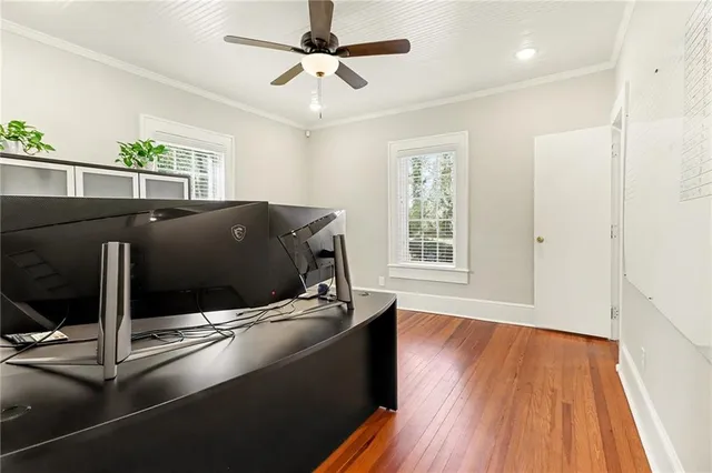 a living room with a bed furniture and a window