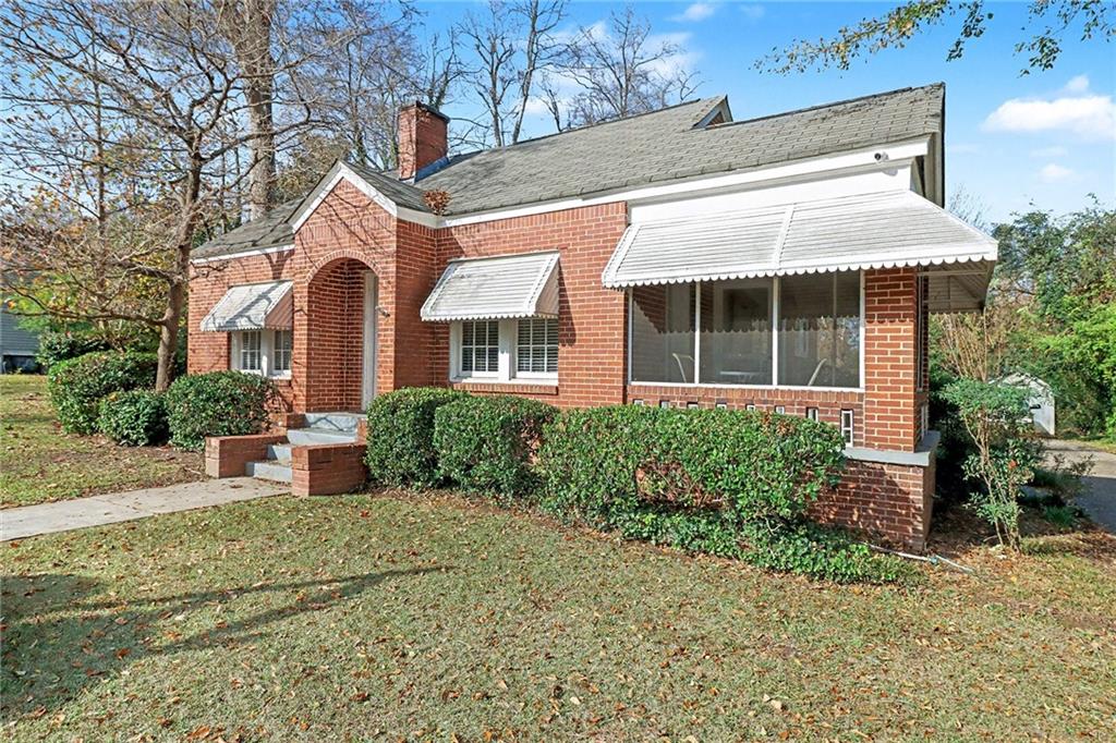 109 Stockbridge Road Jonesboro, GA 30236 - Photo 2 of 16 a front view of a house with garden
