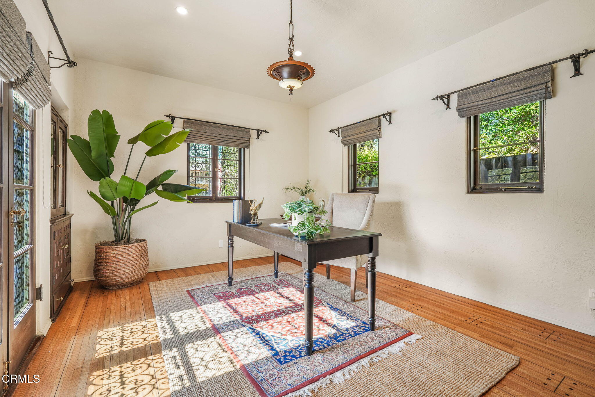 424 Ninita Parkway Pasadena, CA 91106 - Photo 12 of 57 a living room with furniture and a potted plant