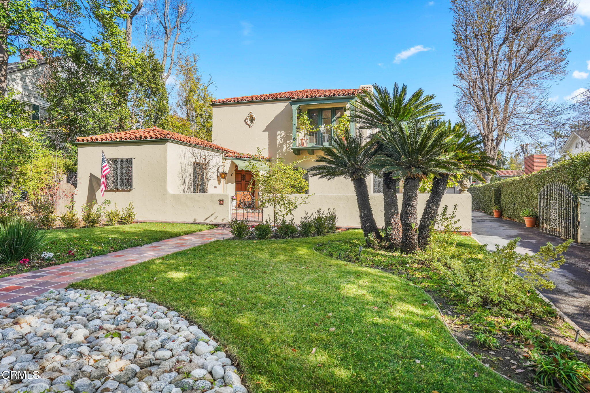 424 Ninita Parkway Pasadena, CA 91106 - Photo 2 of 57 a view of a white house with a big yard and potted plants