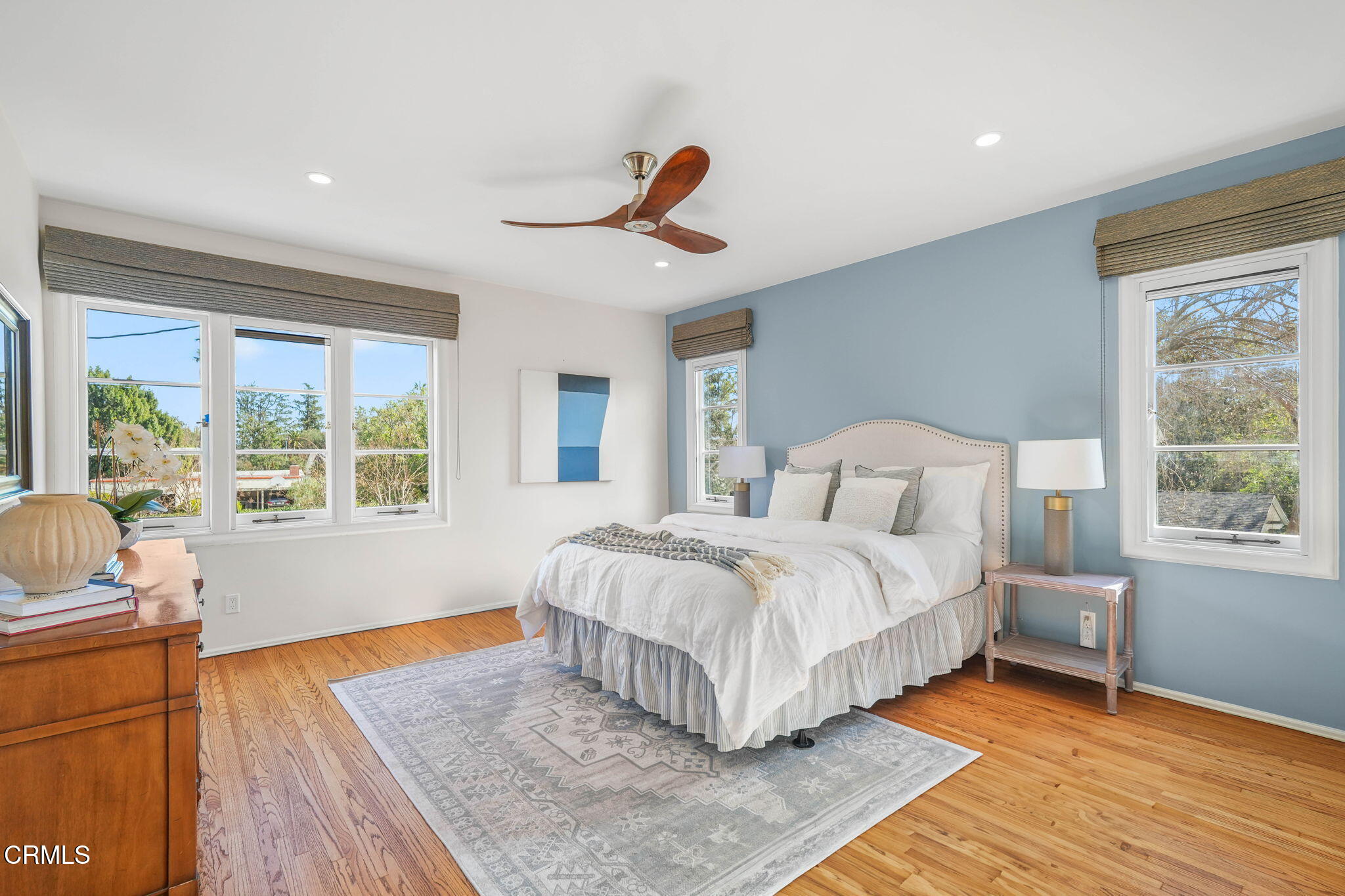 424 Ninita Parkway Pasadena, CA 91106 - Photo 39 of 57 a bedroom with a bed a window and wooden floor