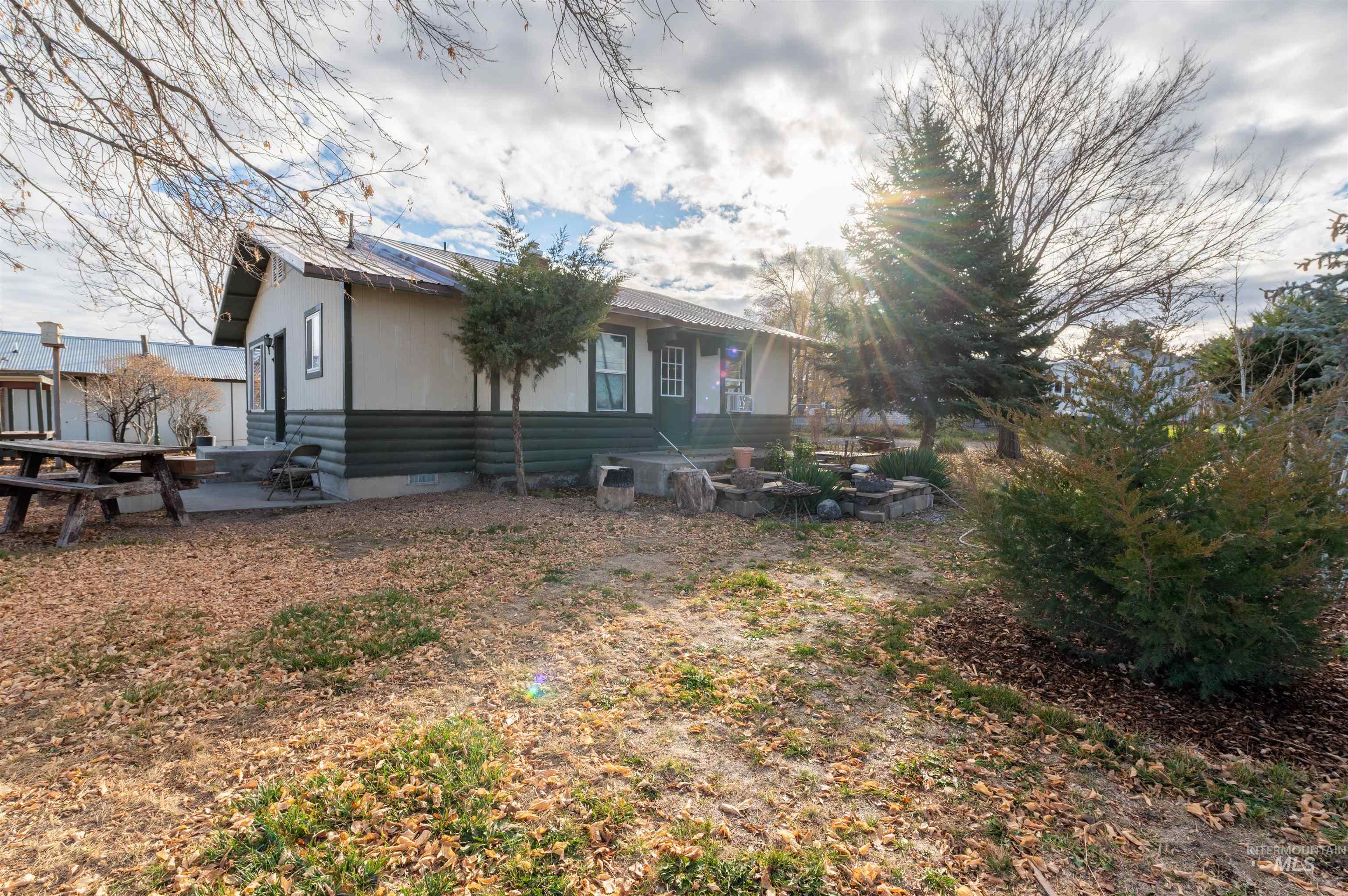 408 Clear Lakes Road Buhl, ID 83316 - Photo 6 of 16 View of property exterior with crawl space, a metal roof, and a patio area