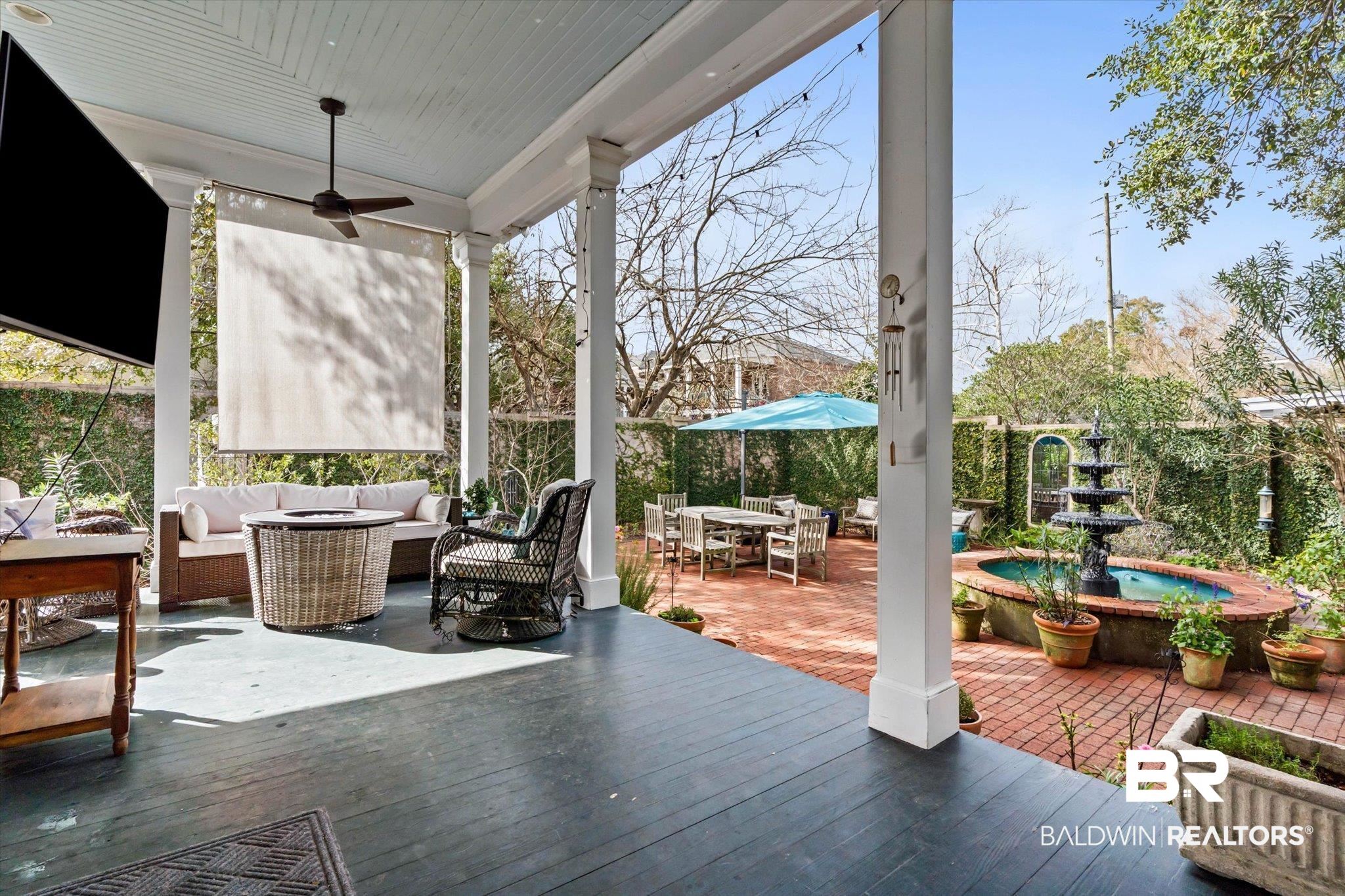 259 North Jackson Street Mobile, AL 36603 - Photo 15 of 42 Deck with outdoor dining area, a patio, an outdoor living space, and a ceiling fan