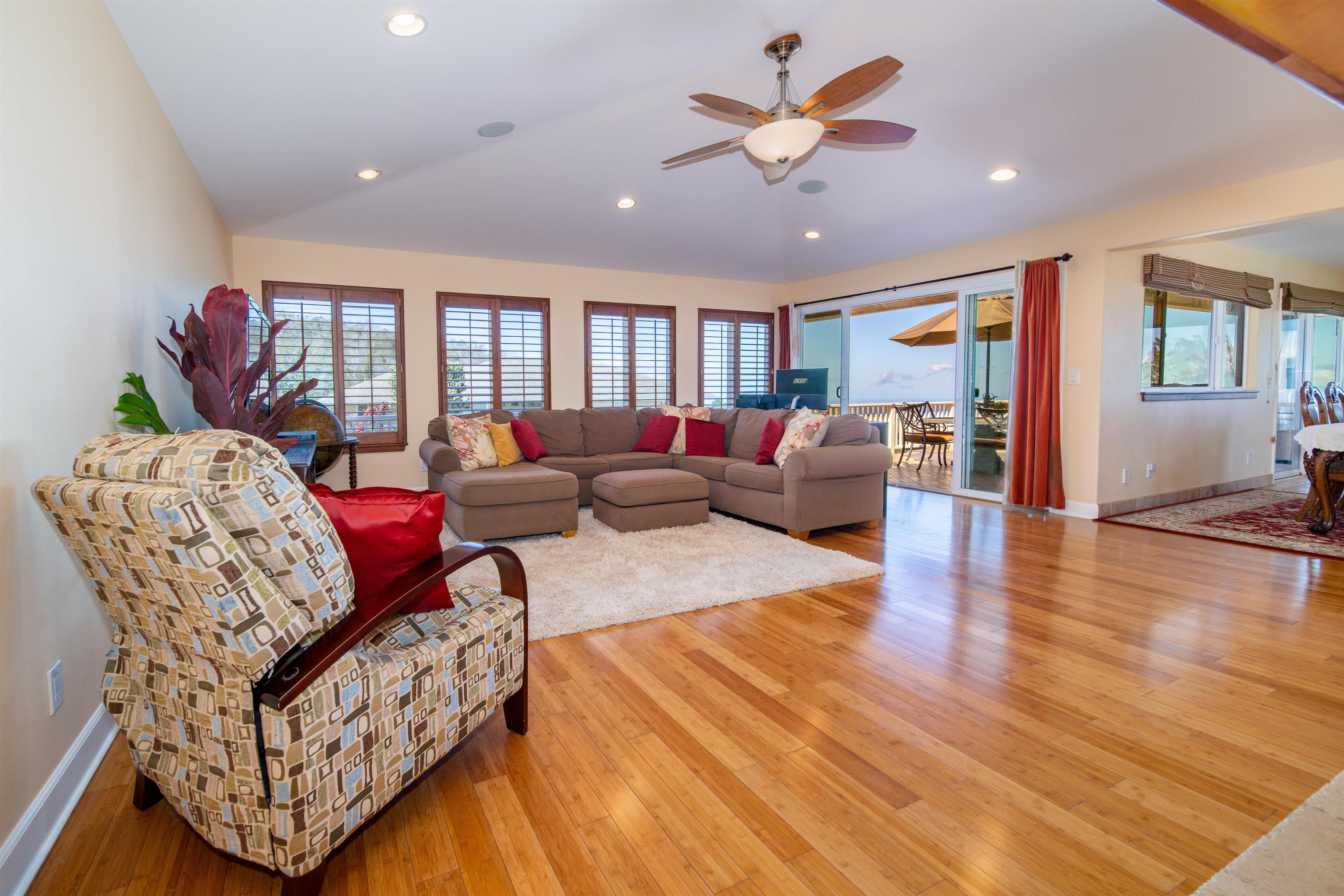 240 Kulamanu Circle Kula, HI 96790 - Photo 4 of 30 a living room with furniture a ceiling fan and a rug