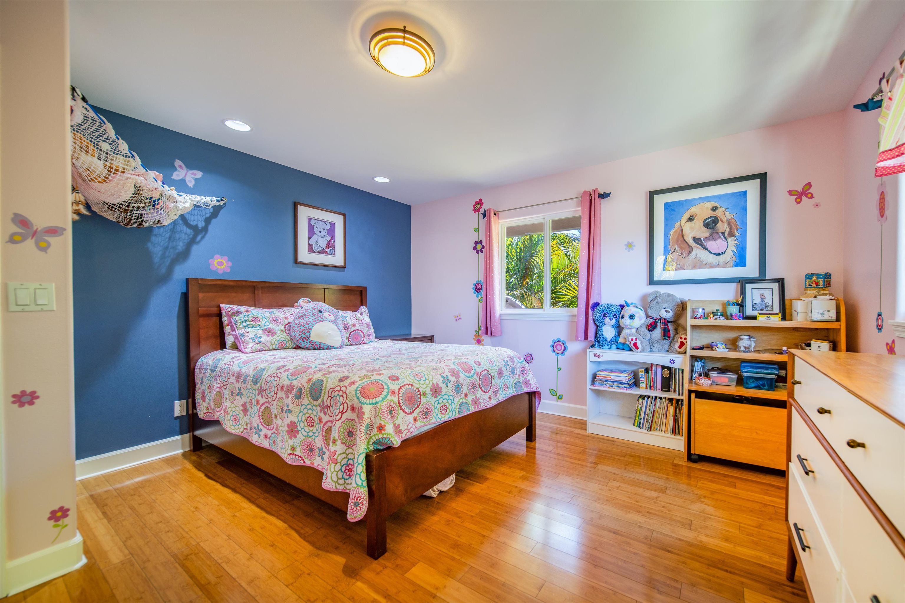 240 Kulamanu Circle Kula, HI 96790 - Photo 9 of 30 a bedroom with a bed and a chandelier