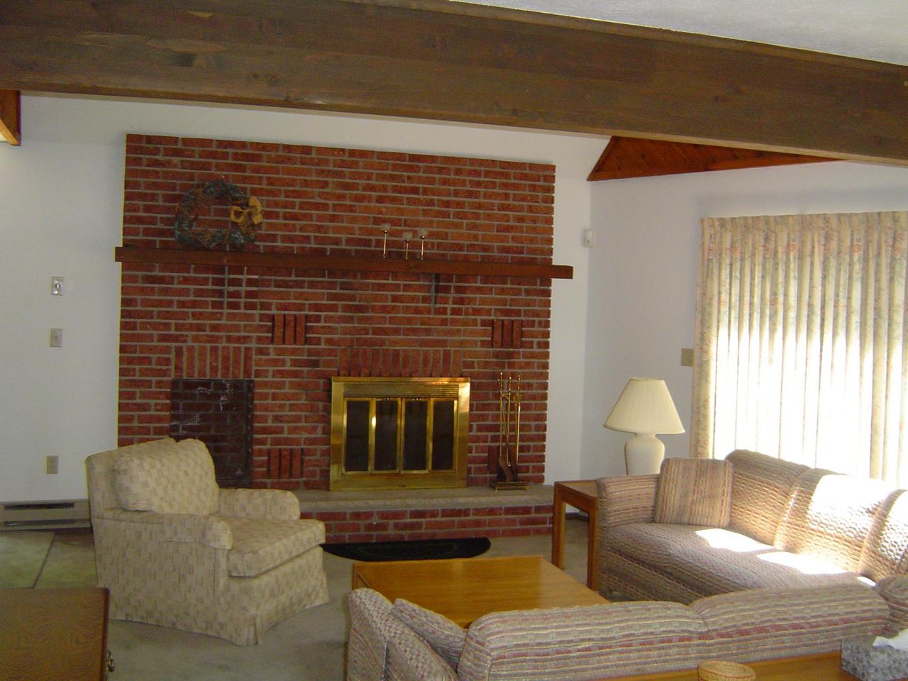 692 Decker Road Bushkill, PA 18324 - Photo 2 of 10 a living room with furniture and a fireplace